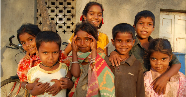 Young children posing for the camera.