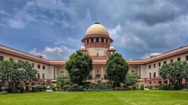 Image of Supreme Court against blue sky.