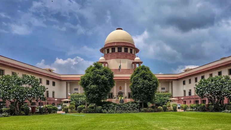 Image of Supreme Court against blue sky.